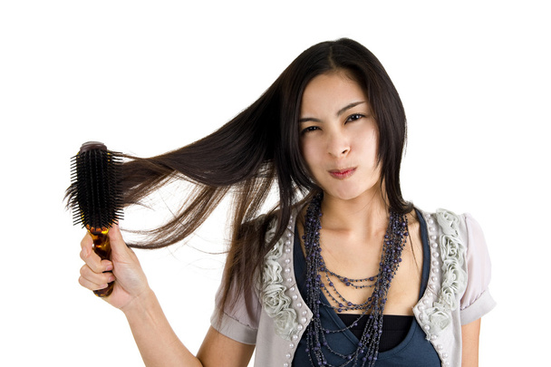 Woman brushing her hair - Photo, Image