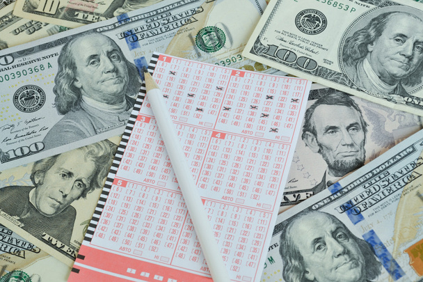 Lottery ticket and pencil on dollar background - Zdjęcie, obraz