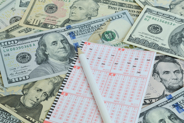 Lottery ticket and pencil on dollar background - Φωτογραφία, εικόνα
