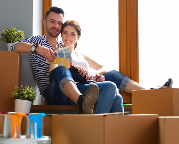 Portrait of young couple moving in new home - Photo, Image
