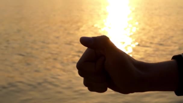 Hand Make Like at Sunset. Sea on the Background. - Footage, Video