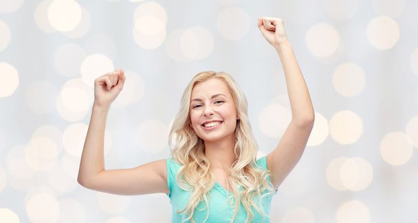 happy young woman or teen girl celebrating victory - Фото, изображение