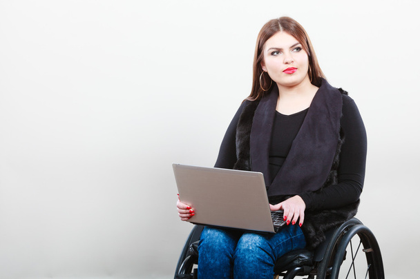 Disabled woman with laptop on wheelchair. - Fotó, kép