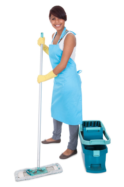 Cheerful woman having fun while cleaning - Foto, imagen
