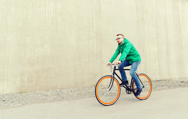 happy young hipster man riding fixed gear bike - Photo, Image