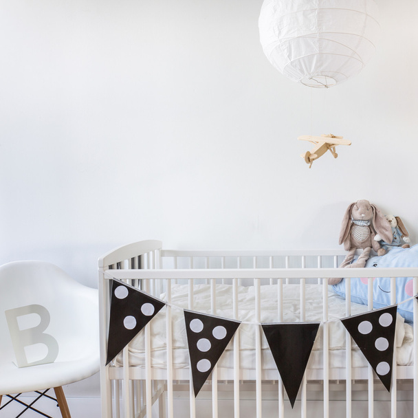 White cot with decoration - 写真・画像