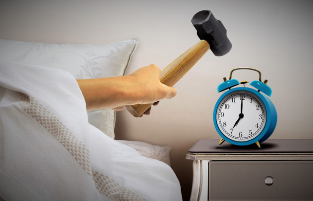 Man smashing alarm clock with sledge hammer - Photo, Image