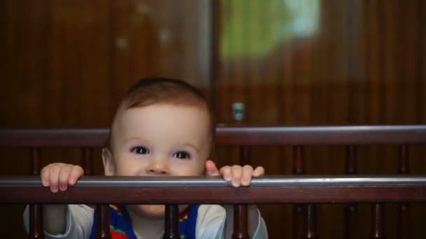 footage nine-month boy playing in crib - 映像、動画