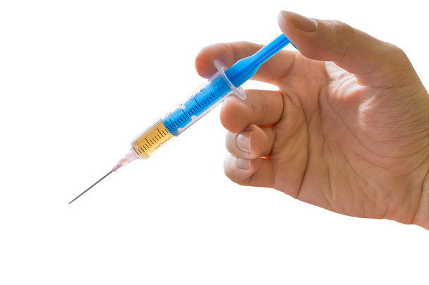 Mão segura seringa. Conceito de vacinação. Isolado sobre fundo branco
 - Foto, Imagem