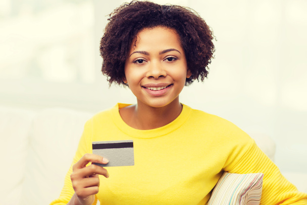 happy african woman with credit or debit card - Фото, изображение