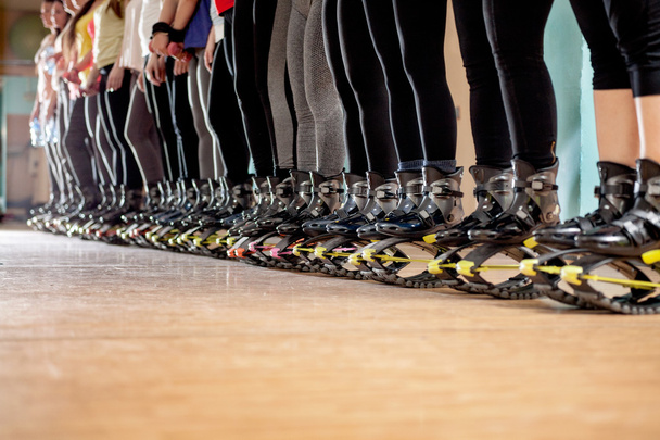 group of people doing exercises with  kangoo shoes - Foto, Imagem