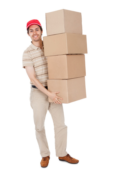 Delivery man carrying stack of boxes - Foto, Imagem