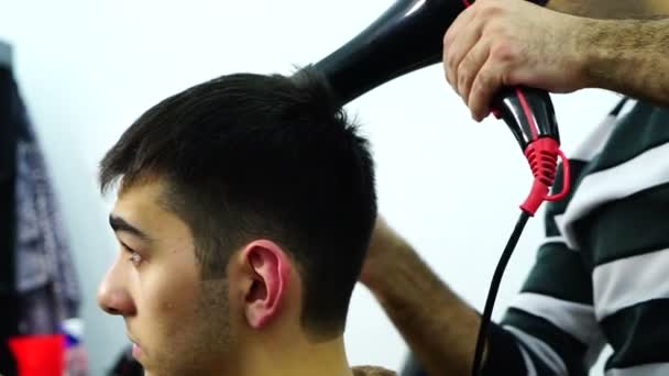 Close up of young man barber finishing work. - Footage, Video