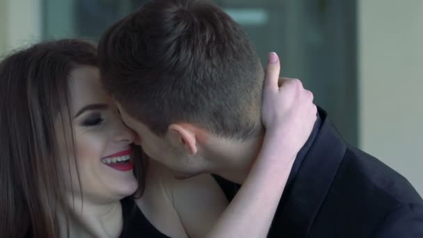 Portrait of a passionate couple in love  kissing and embracing. Slow motion - Video