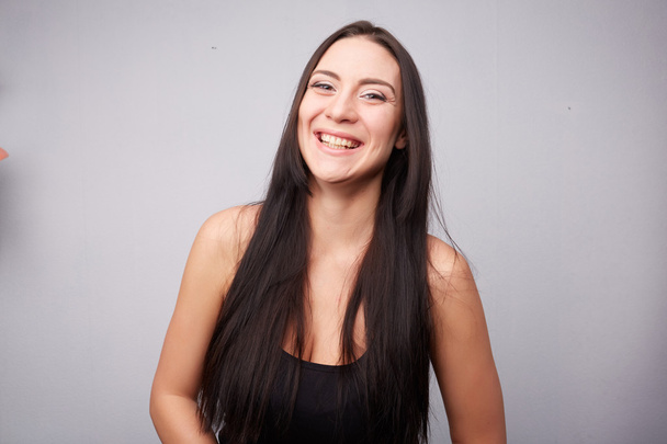 Beautiful brunette woman laughing - Фото, изображение