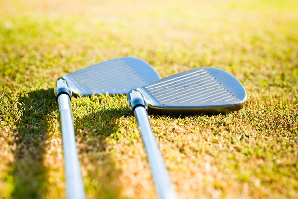 Golf clubs on grass - Foto, Imagen