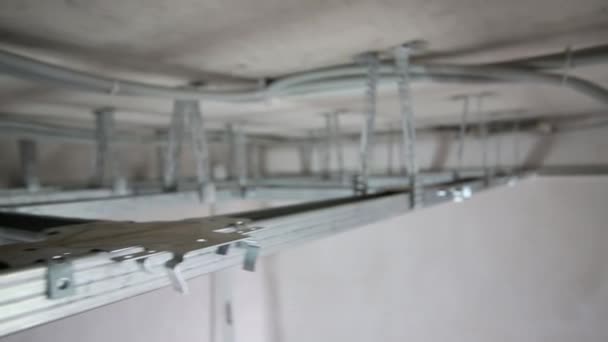 Frame made of metal profile for hung ceiling in new flat - Video