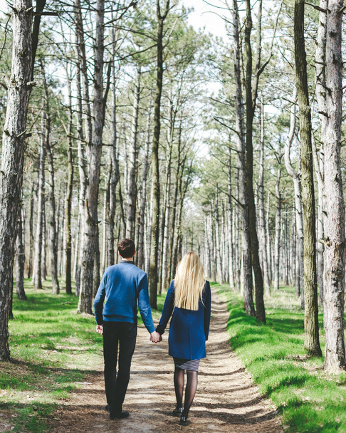 Beautiful young loving couple in spring forest - Fotografie, Obrázek