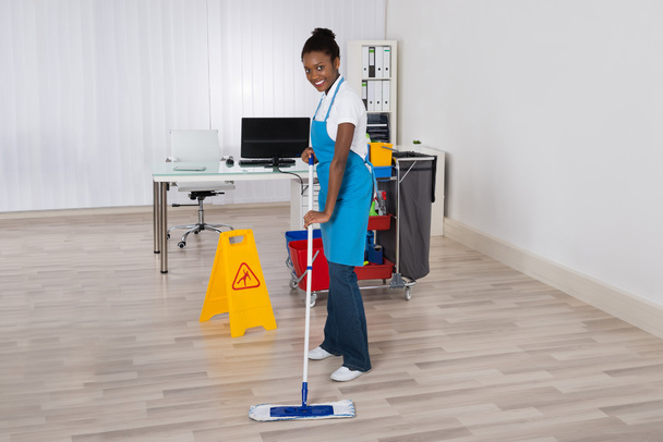 Female Janitor Mopping Floor  - 写真・画像