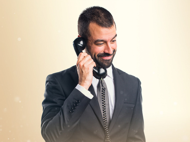 Businessman making phone gesture - Photo, Image
