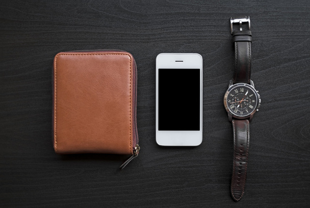 White mobile phone, watch and wallet - 写真・画像