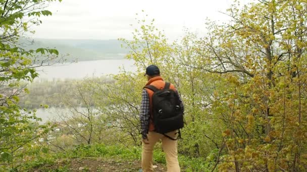 man with a backpack photographed on a smartphone natural landscape - Footage, Video