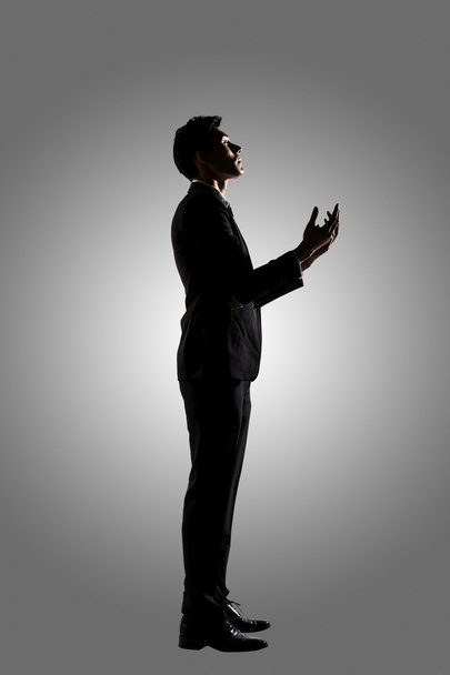 Asian businessman praying - Фото, изображение