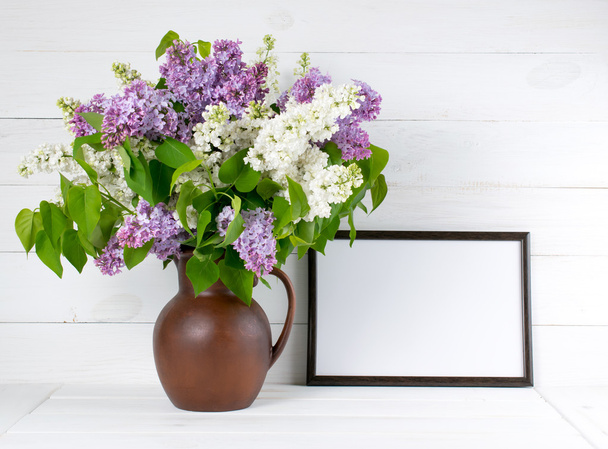 Lilac bouquet in jug with motivational frame - Fotó, kép
