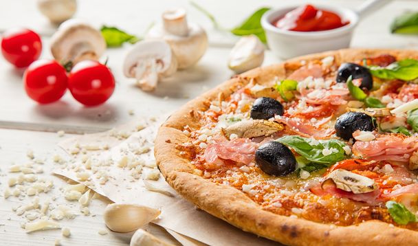 Rustic pizza with ingredients, top view - Photo, Image
