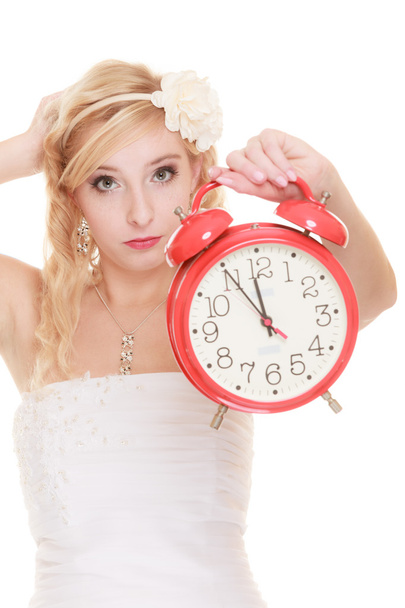 Wedding. Time to get married. Bride with alarm clock. - 写真・画像