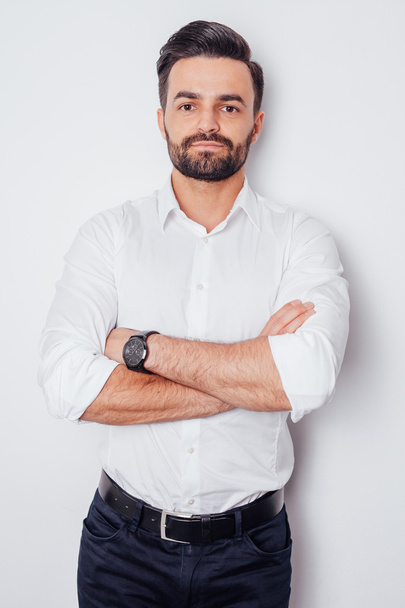 Portrait of a young businessman in a white shirt with arms cross - Fotoğraf, Görsel