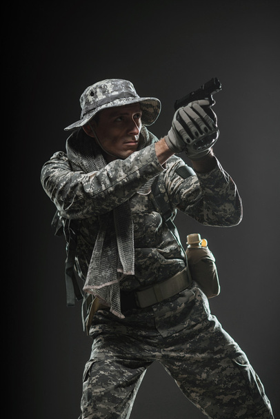 Special forces soldier man with gun on a  dark background - Foto, Imagen