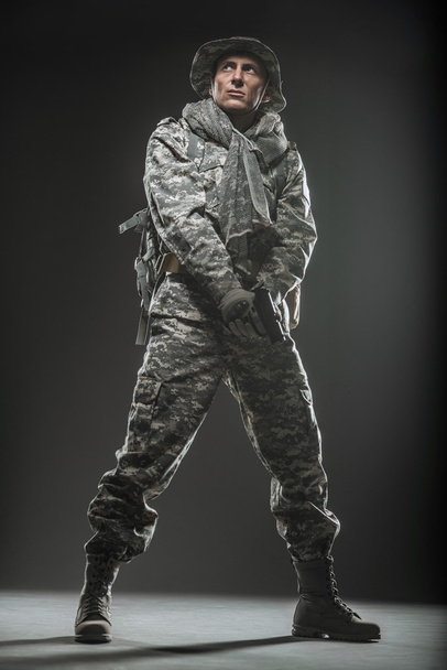 Special forces soldier man with gun on a  dark background - Fotoğraf, Görsel