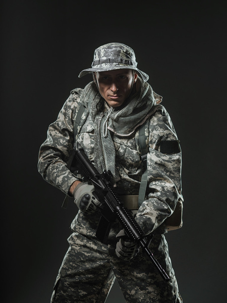 Special forces soldier man with Machine gun on a  dark background - Foto, Imagen