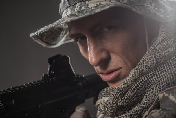 Special forces soldier man with Machine gun on a  dark background - Fotoğraf, Görsel