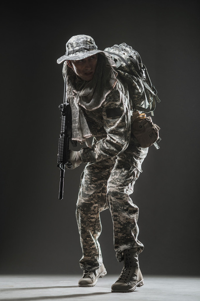 Special forces soldier man with Machine gun on a  dark background - Valokuva, kuva