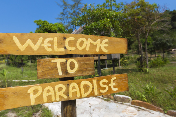Welcome to paradise sign with green trees and blue sky in Cambod - Photo, Image