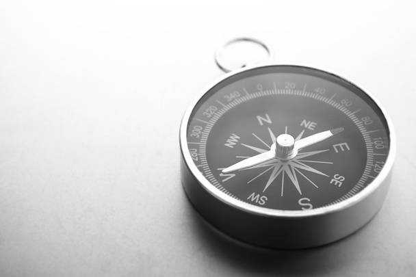 Compass on a gray gradient background, place for text - Photo, Image