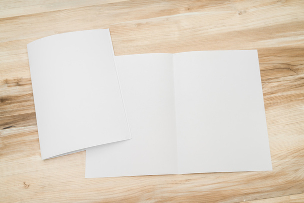 Bifold white template paper on wood texture - 写真・画像