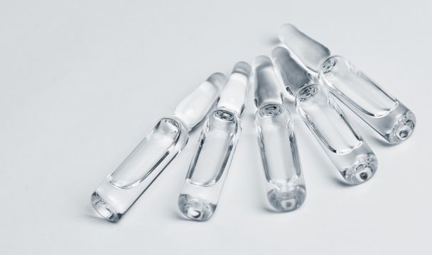 glass ampoules with liquid medicine  - 写真・画像