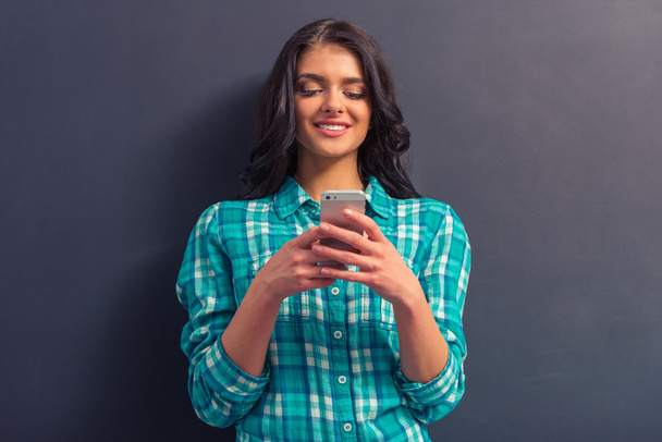 Attractive young woman with gadget - Foto, immagini