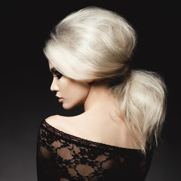 Beautiful blonde woman with elegant hairstyle  - Fotó, kép