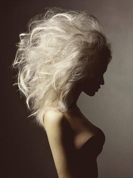 Beautiful blonde woman with volume hairstyle - Фото, зображення