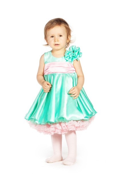 Little girl in a green dress - Foto, imagen