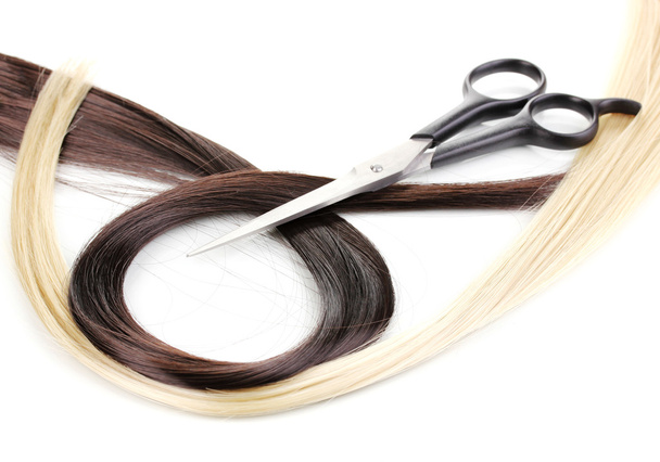Shiny blond and brown hair with hair cutting shears isolated on white - Photo, image