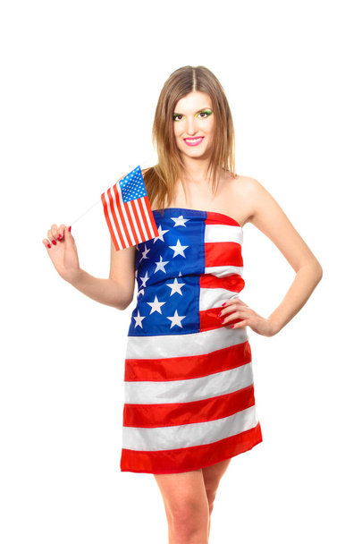 Beautiful young woman wrapped in American flag isolated on white - Foto, Bild