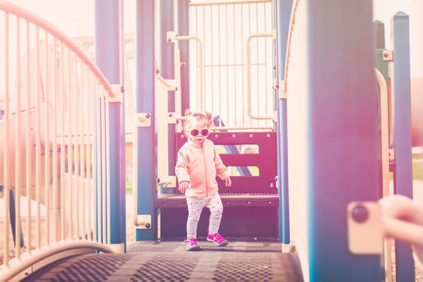 Toddler playing on playground - Photo, Image
