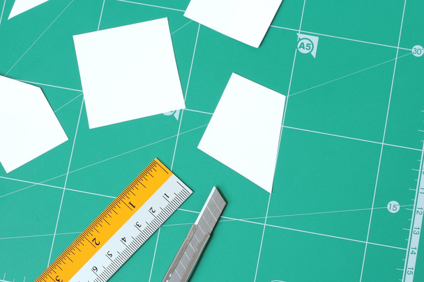 paper and green cutting mat - Photo, Image