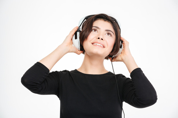 Happy woman listening music in headphones - Fotografie, Obrázek