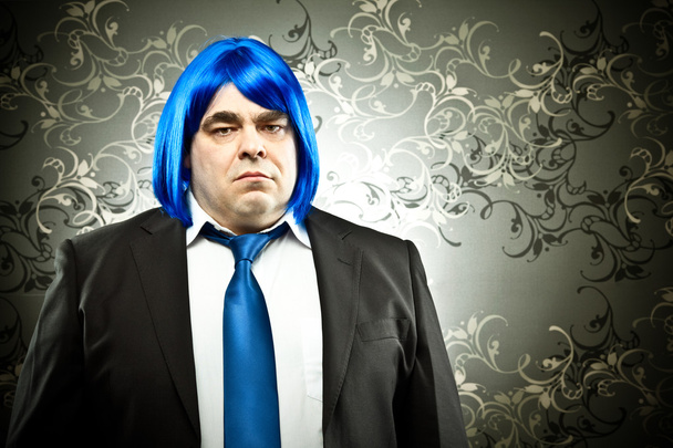 businessman with colored tie and hair wig on tapestry background - Foto, Imagen